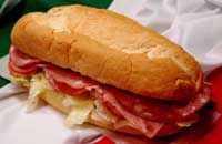 An Italian Cold Cut sub on a whole loaf of bread!
